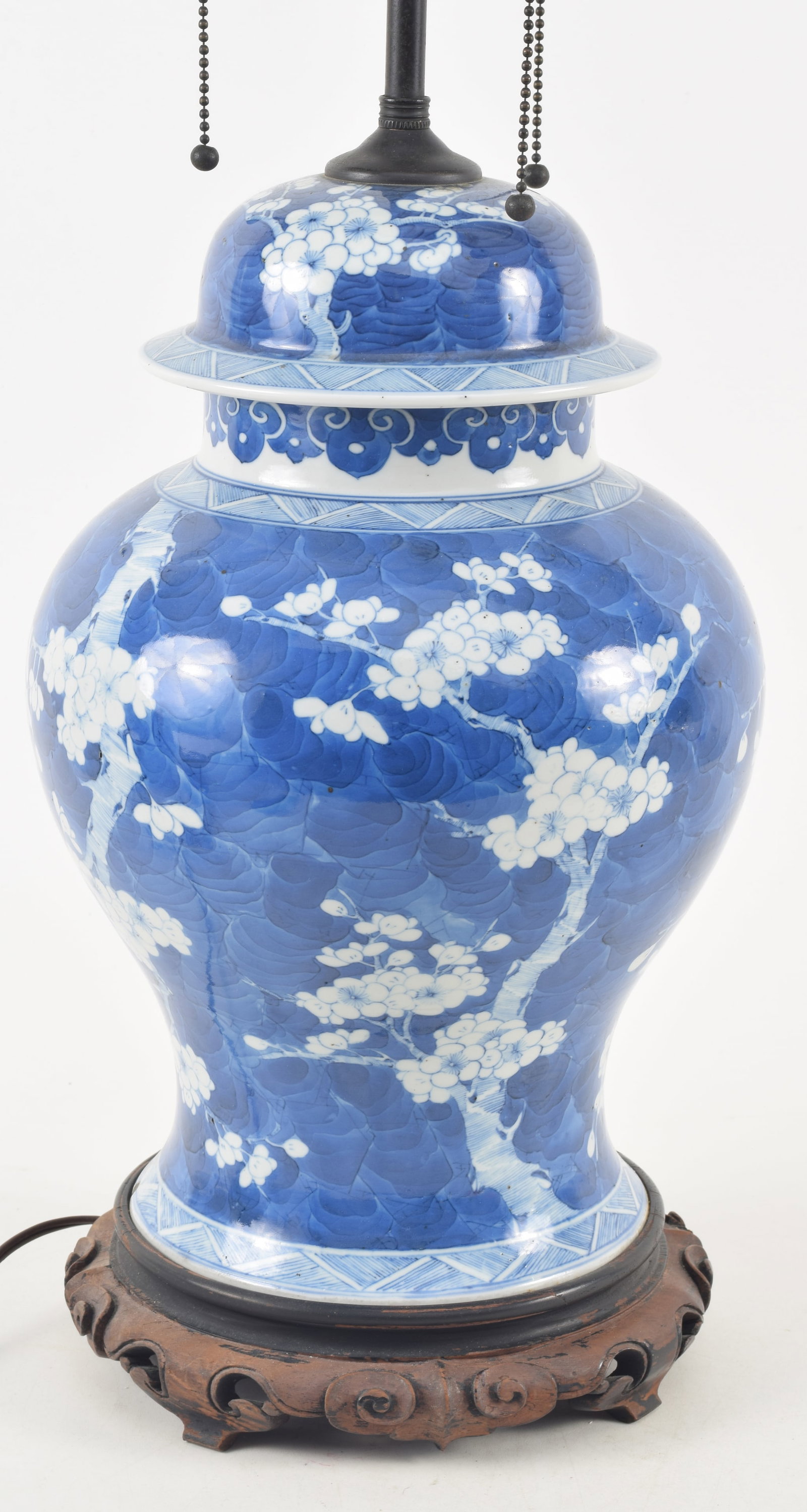 Chinese porcelain covered vase, 19th/20th century. Blue and white prunus decoration. Drilled and (1 of 7)