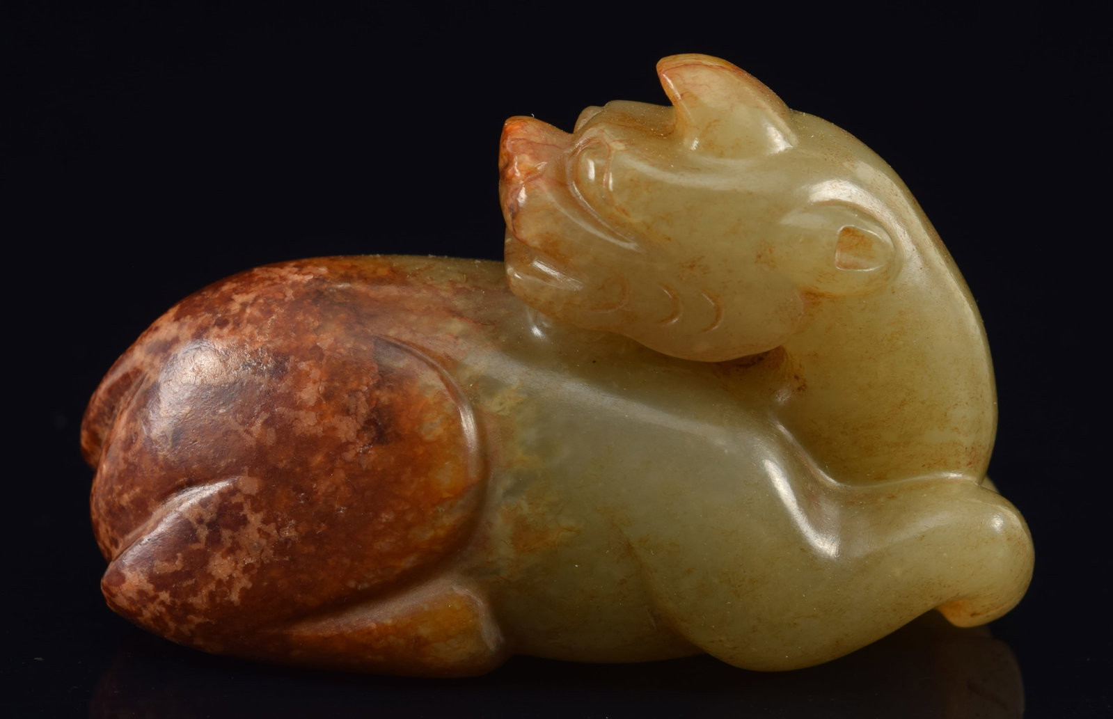 Jade animal. China. 19th century. Celadon colored stone with russet markings. 2.75in length. (1 of 6)