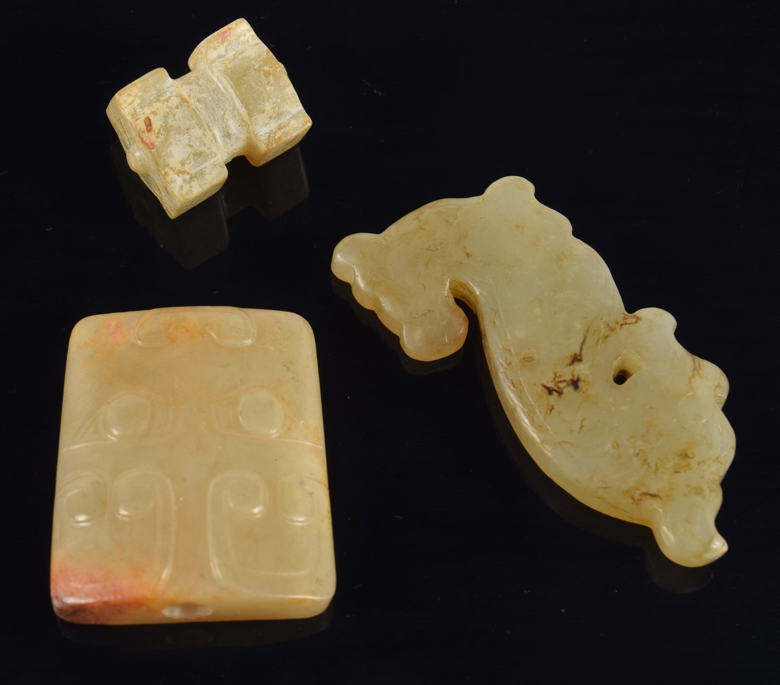 3 jade carvings. China. Archaic style. 19th century or earlier. Each about 1in. (1 of 5)