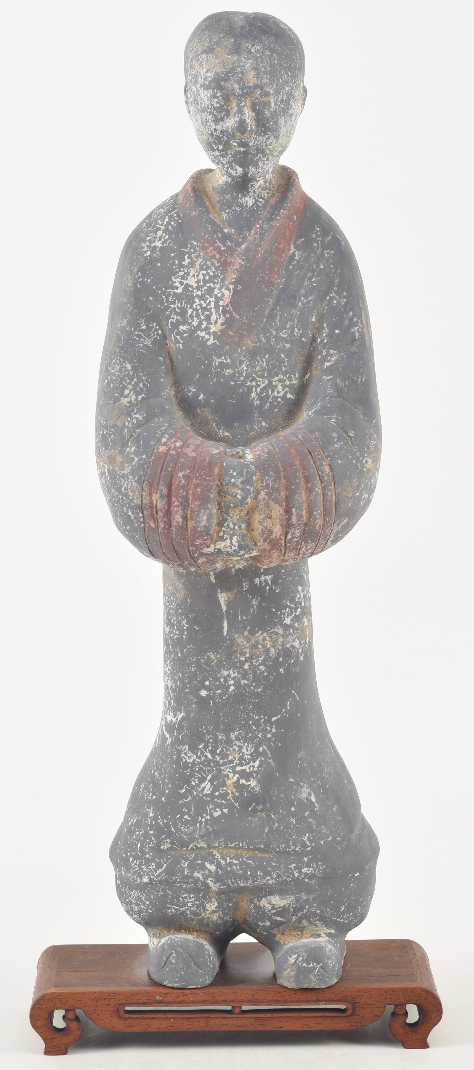 Chinese tomb figure. Likely Han period. Robed woman with traces of red pigment on a black robe.: Chinese tomb figure. Likely Han period. Robed woman with traces of red pigment on a black robe. Associated stand. Figure: 21in high.
