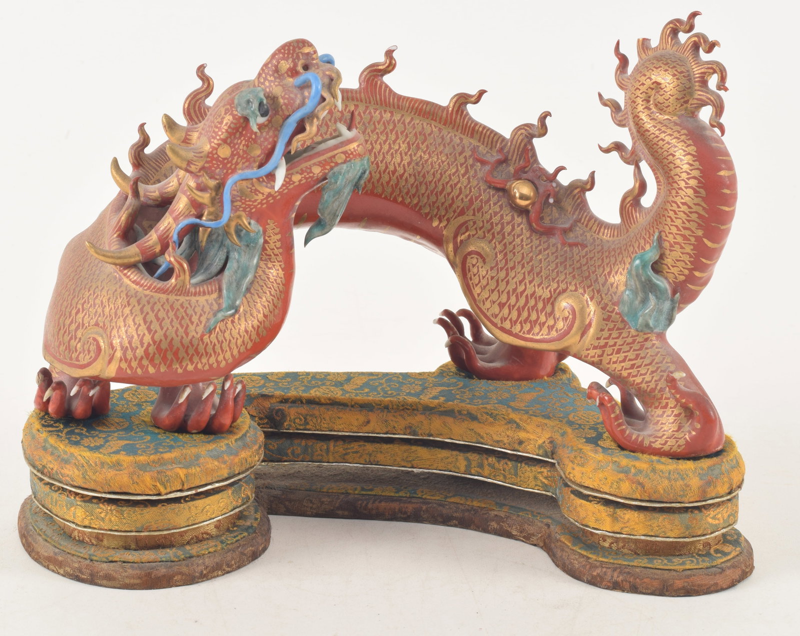 Chinese porcelain dragon sculpture on fitted brocade stand. Early/mid 20th century. Several minor (1 of 8)