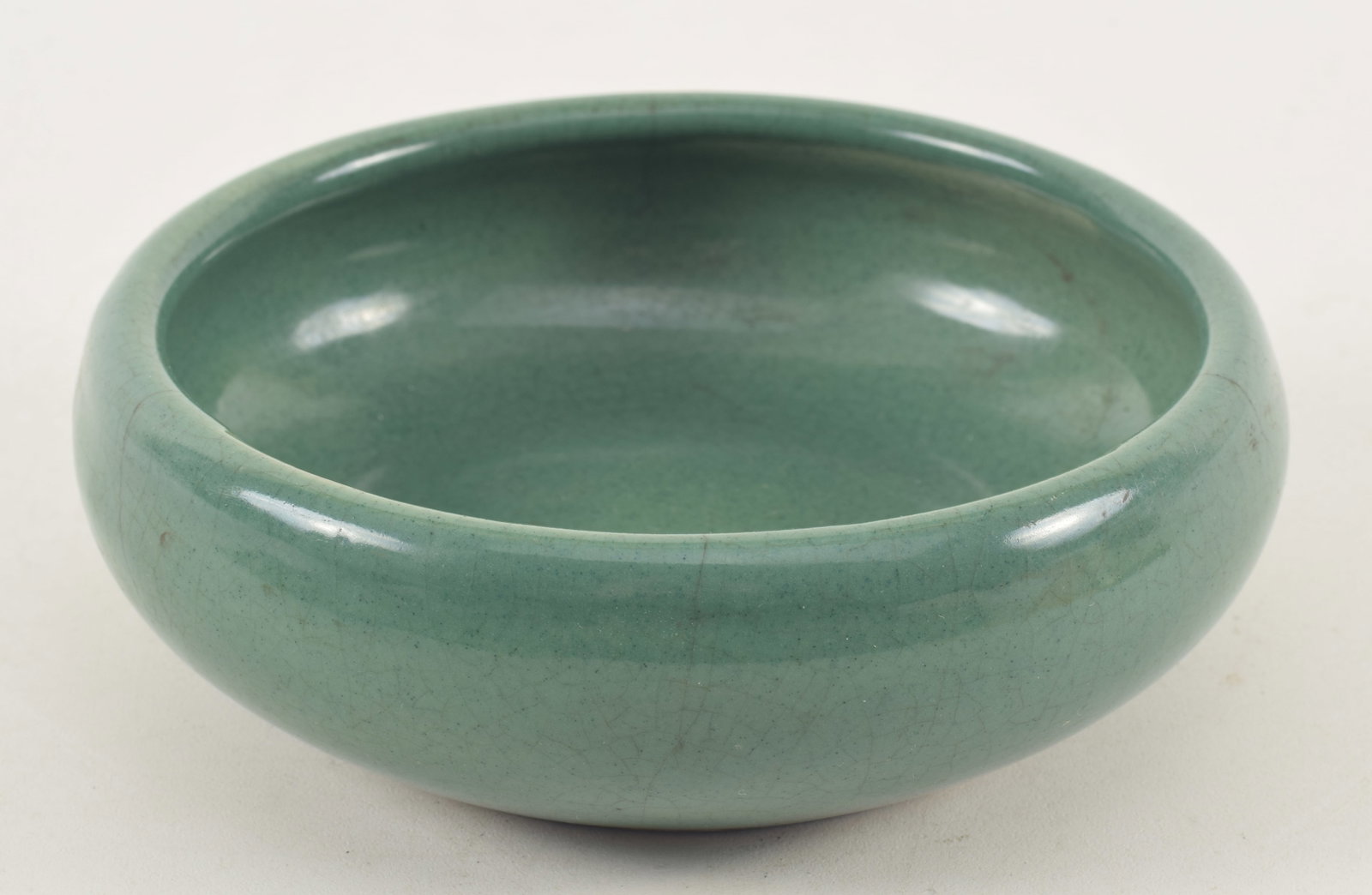 Chinese porcelain bowl, 20th century. Dark celadon glaze. Wear to interior of rim. Old hairline in (1 of 7)
