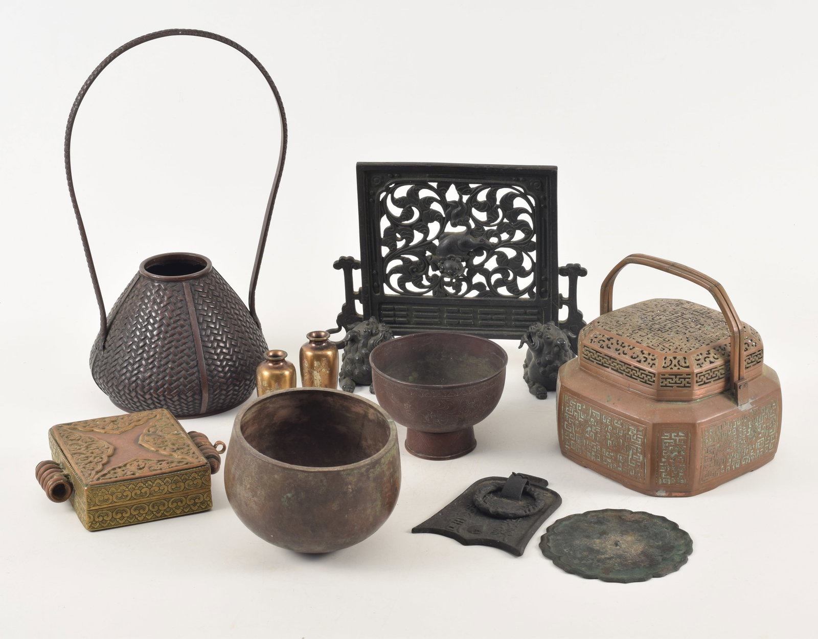 Lot of various metal works. To include: 18th/19th century copper Chinese handwarmer, a kau shrine, (1 of 9)