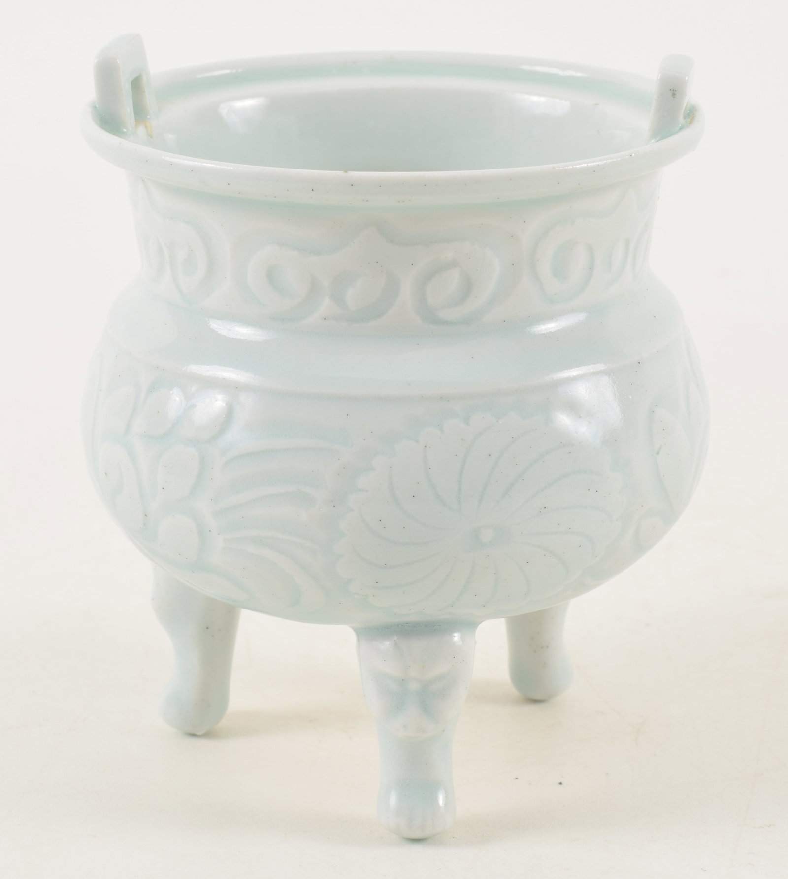 19th century Chinese pale blue glazed carved porcelain censer with tripod base. Mask head legs. (1 of 6)