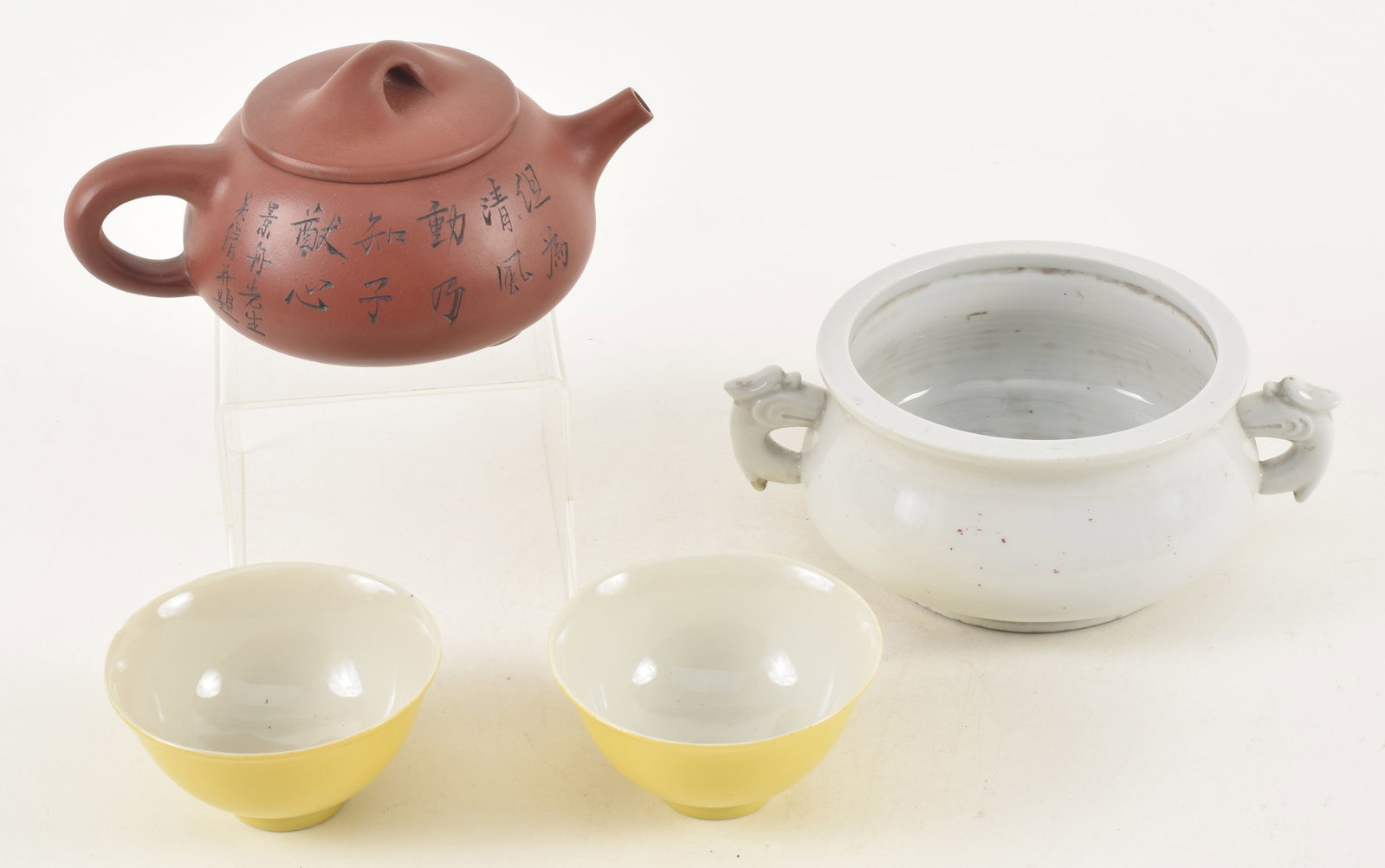 Lot of 4 items. China. To include: a blanc de chine censer, pair of yellow cups, a yixing teapot, (1 of 12)