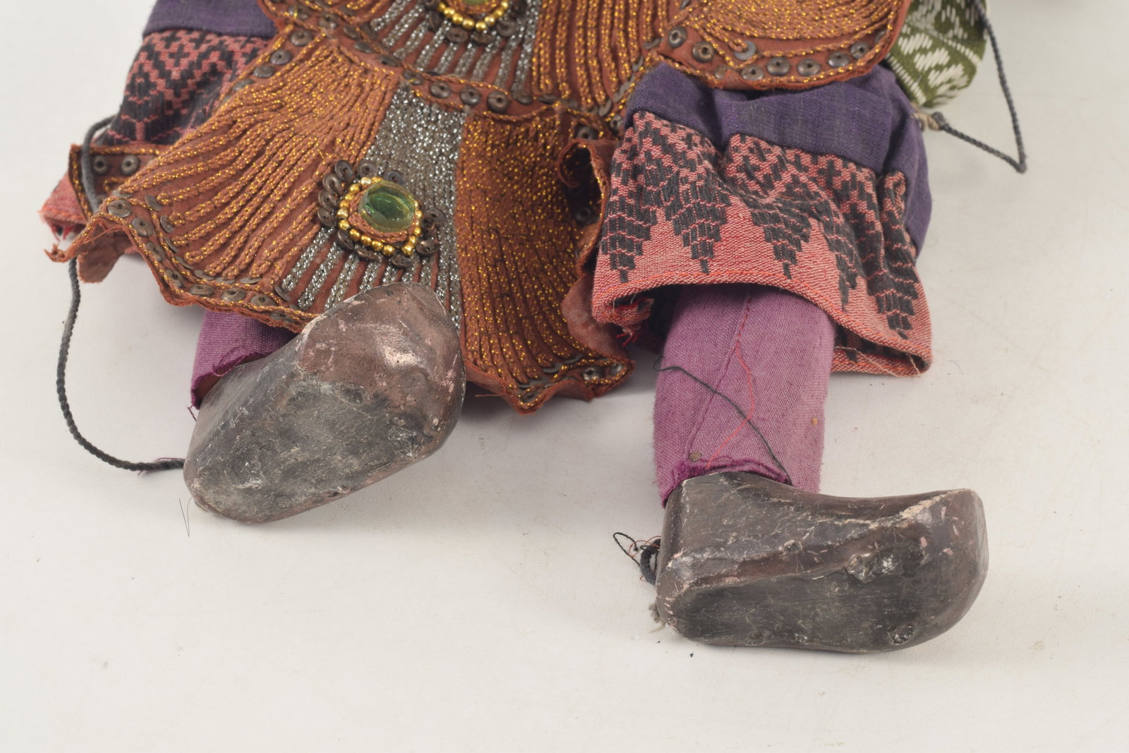 Puppet. Myanmar, ca 1950. Lacquered wooden body. Ornate later robes. About 22in length. - 3