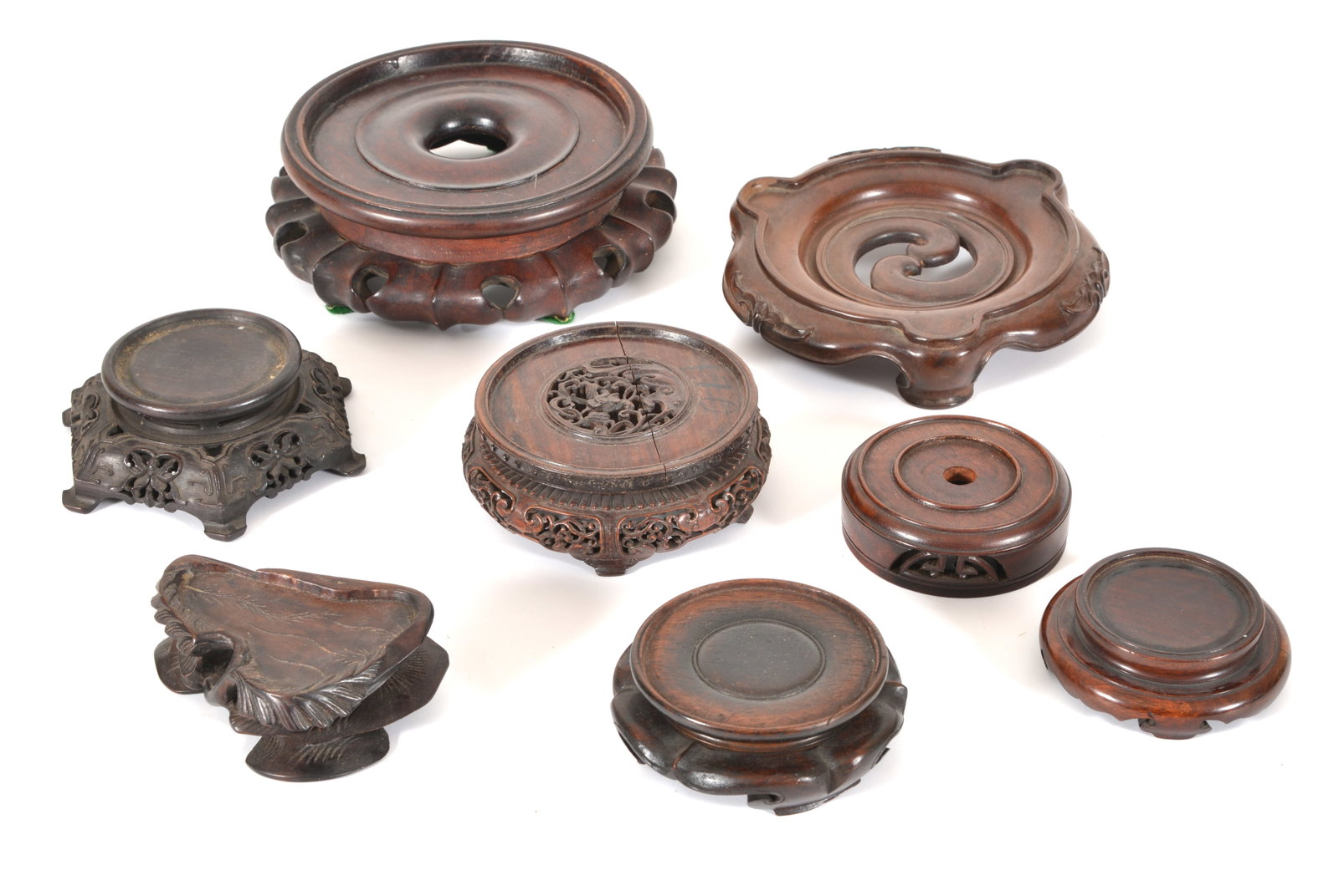 Lot 8 Chinese hardwood stands including serveral fine circular carved stands. (1 of 5)