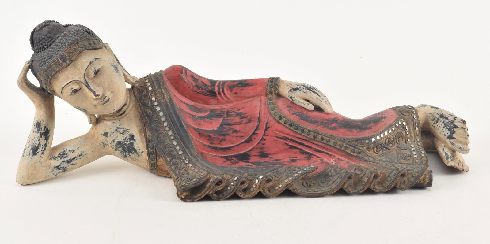 Southeast Asian carved and decorated recumbent figure. 20th century. 22in length. (1 of 4)