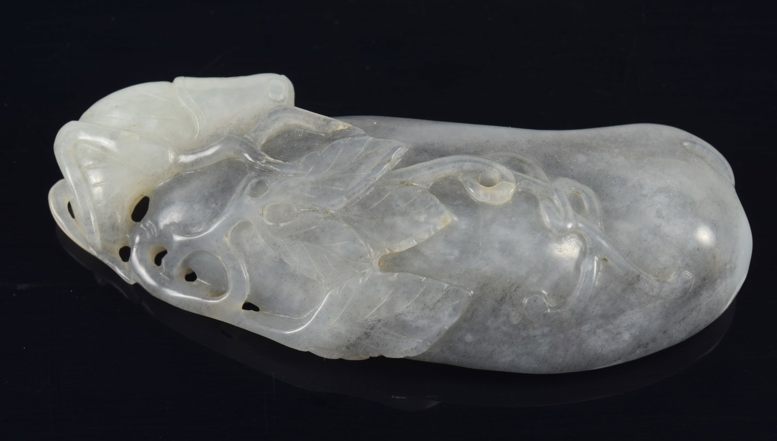 Jade carving. China. 19th/20th century. White/grey stone carved as a pea pod with insect and foliage (1 of 4)