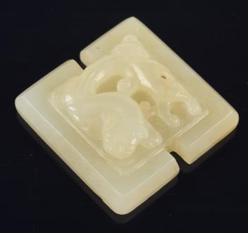Jade pendant. China. 19th century. Carved with a dragon. Pale celadon color stone. 1.25in. (1 of 3)