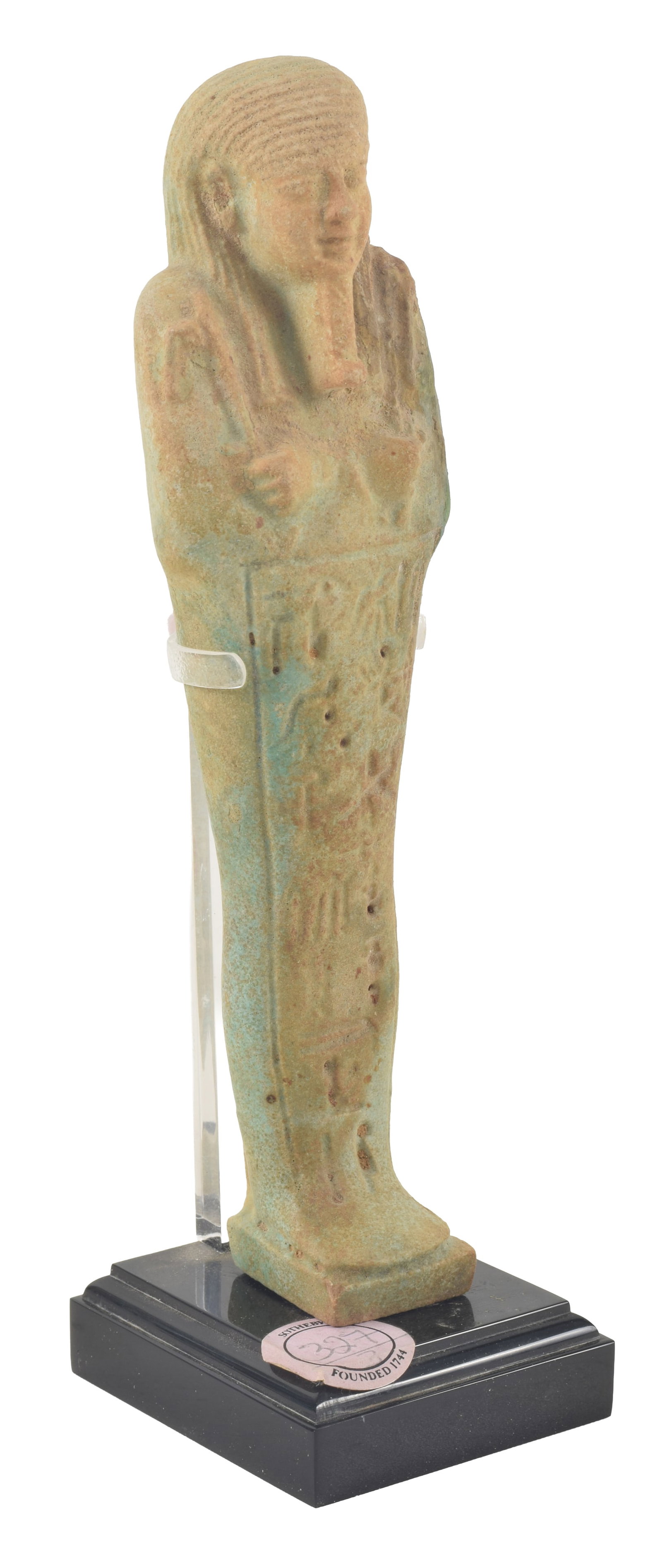 Egyptian, 26th/30th dynasties, pale green faience ushabti figure. Modeled with pick and hoe, molded (1 of 8)