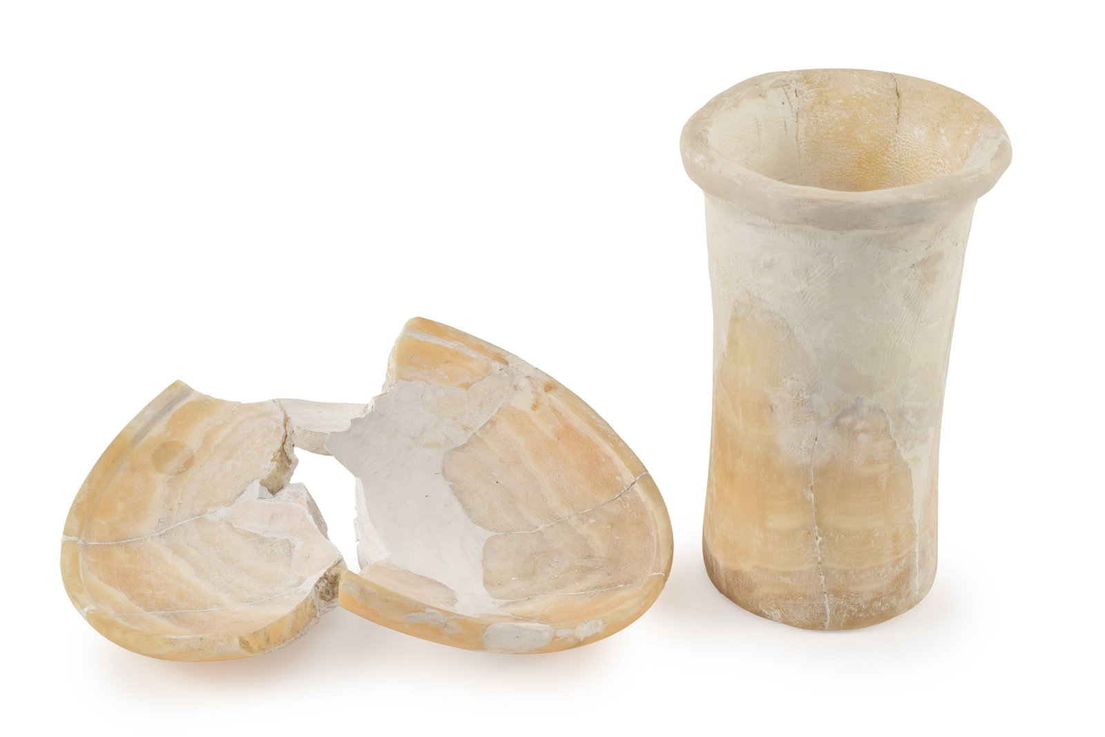 Egyptian, 1st Dynasty, shallow alabaster basin together with a cylindrical vessel. Restored. Basin: Egyptian, 1st Dynasty, shallow alabaster basin together with a cylindrical vessel. Restored. Basin diameter 10.5 in, vessel height 9.5 in. From the collection of Dr. Bruce L. Ralston, Tuxedo Park NY. 