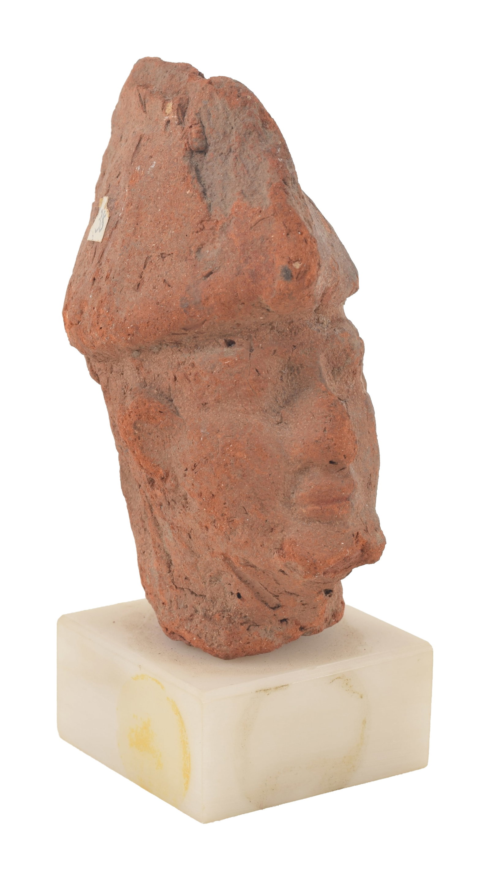 Romano-Egyptian, 1st/2nd Century A.D. terracotta head of a man with a headdress. With old Sotheby's: Romano-Egyptian, 1st/2nd Century A.D. terracotta head of a man with a headdress. With old Sotheby's label. Height 3.25 in. From the collection of Dr. Bruce L. Ralston, Tuxedo Park NY. Dr. Ralston asse