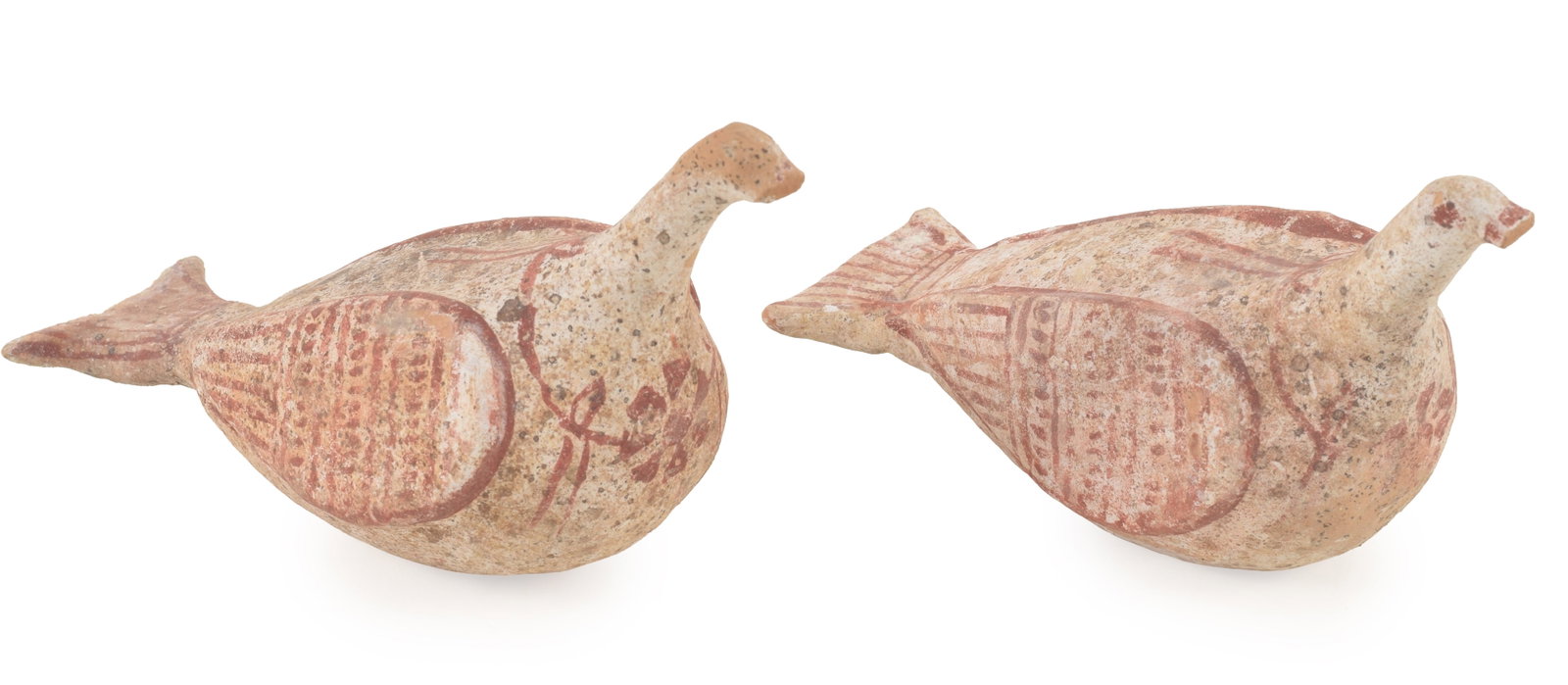 A pair of Hellenistic painted terracotta doves, Apulia, 3rd Century B.C. Each with red collar and: A pair of Hellenistic painted terracotta doves, Apulia, 3rd Century B.C. Each with red collar and rosettes at the breast. Lenghts 5 3/4 in and 6 1/4 in. From the collection of Dr. Bruce L. Ralston, Tu