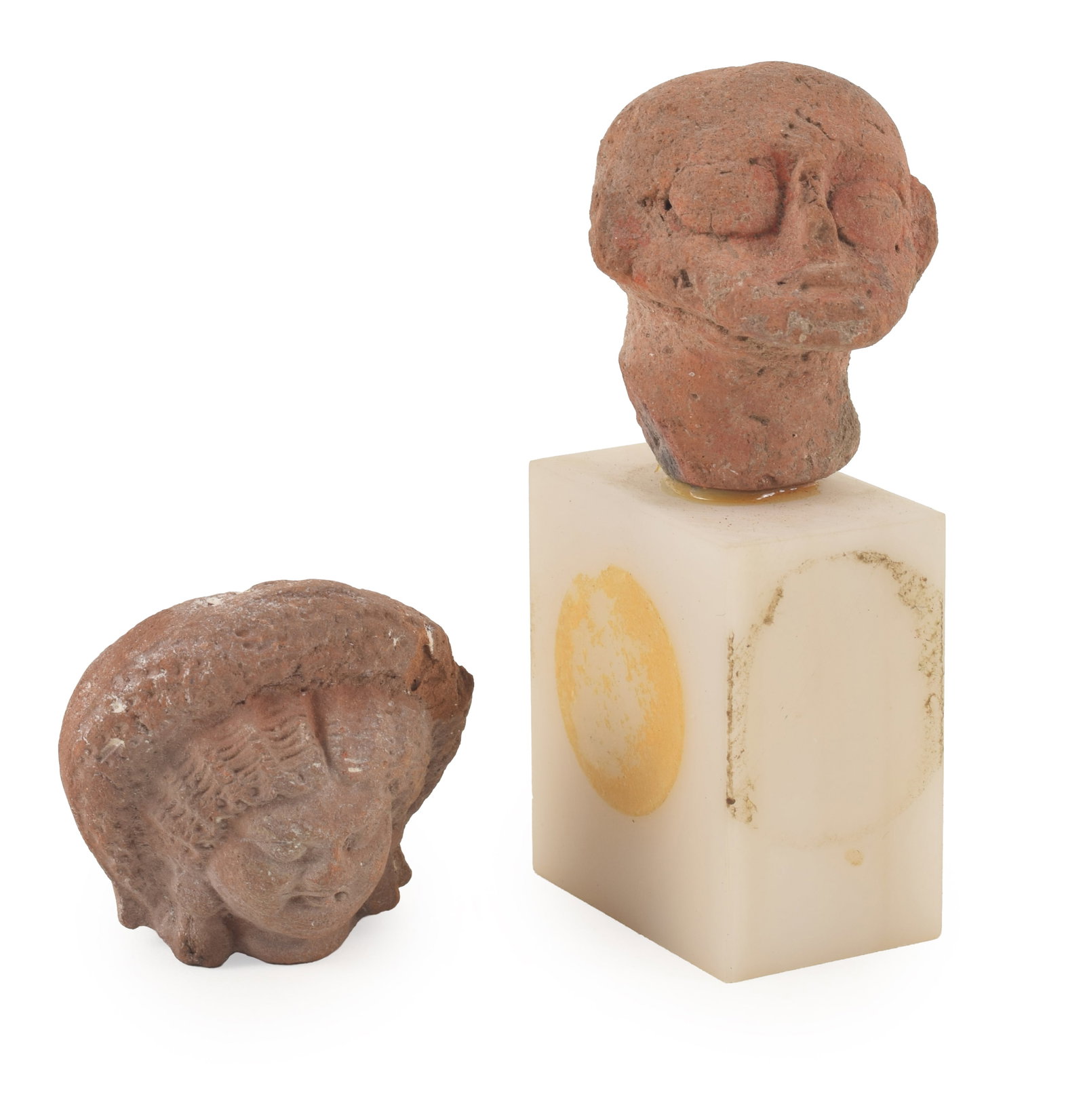 [2] Ancient earthenware heads, including a Hellenistic image of a female goddess and a grotesque (1 of 5)