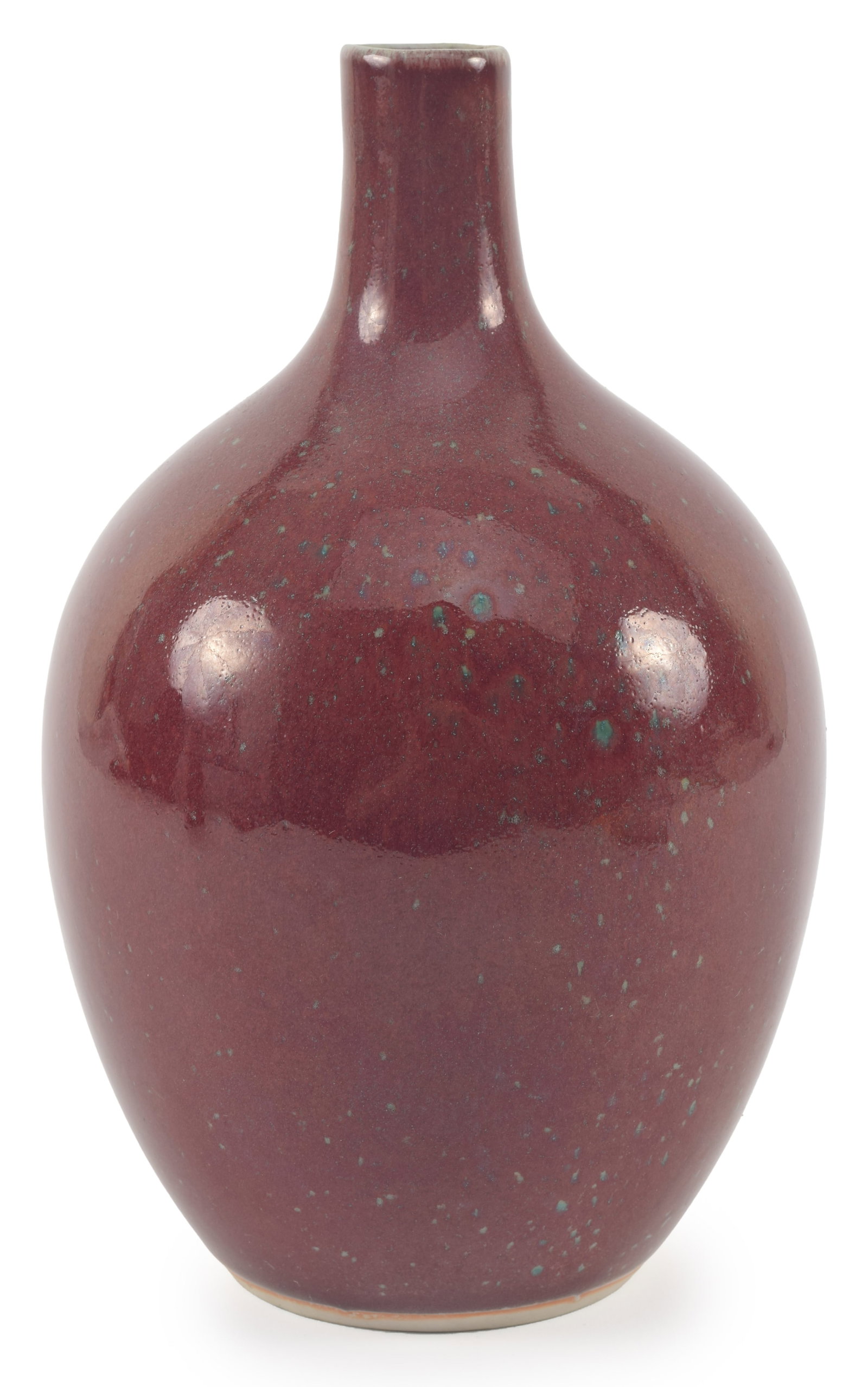 Oxblood glazed porcelain bottle vase. Celadon spotting. 8.5in high. (1 of 5)