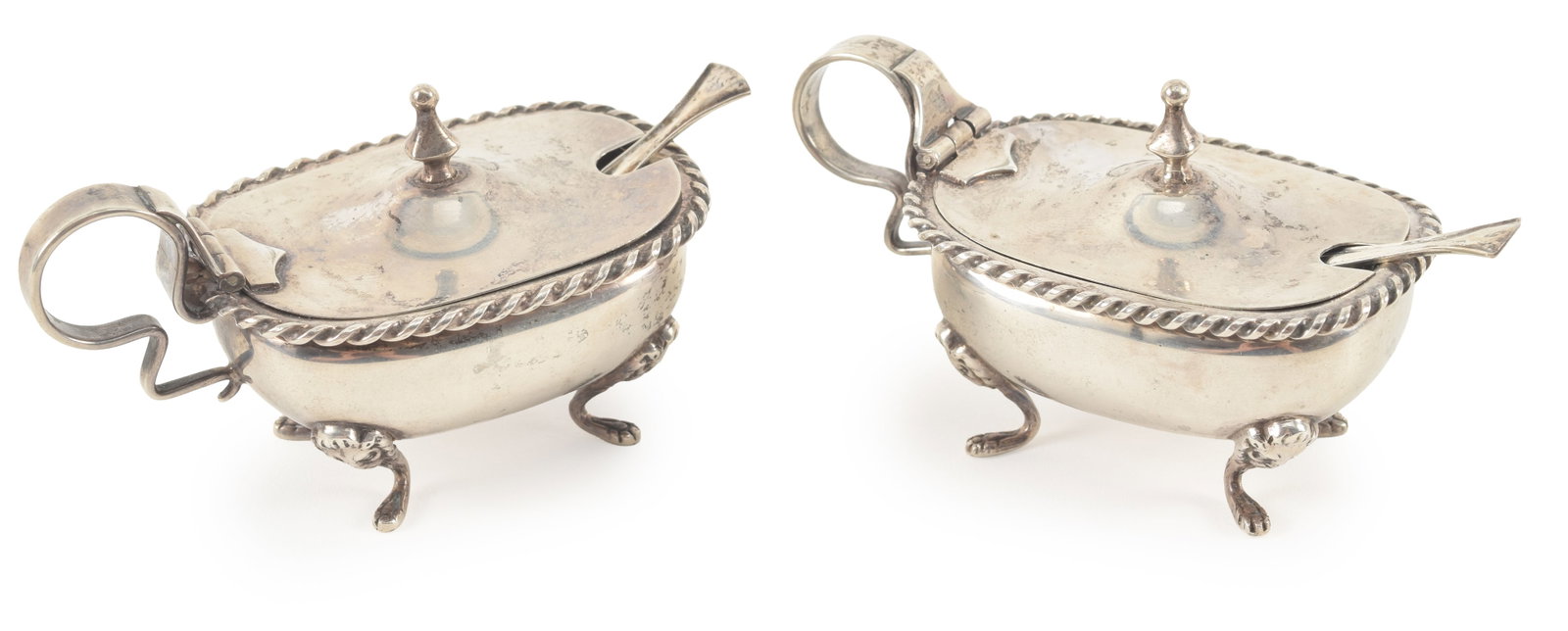 Pair of continental 800 silver mustard pots and spoons. Gadrooned rim decoration and resting on (1 of 4)