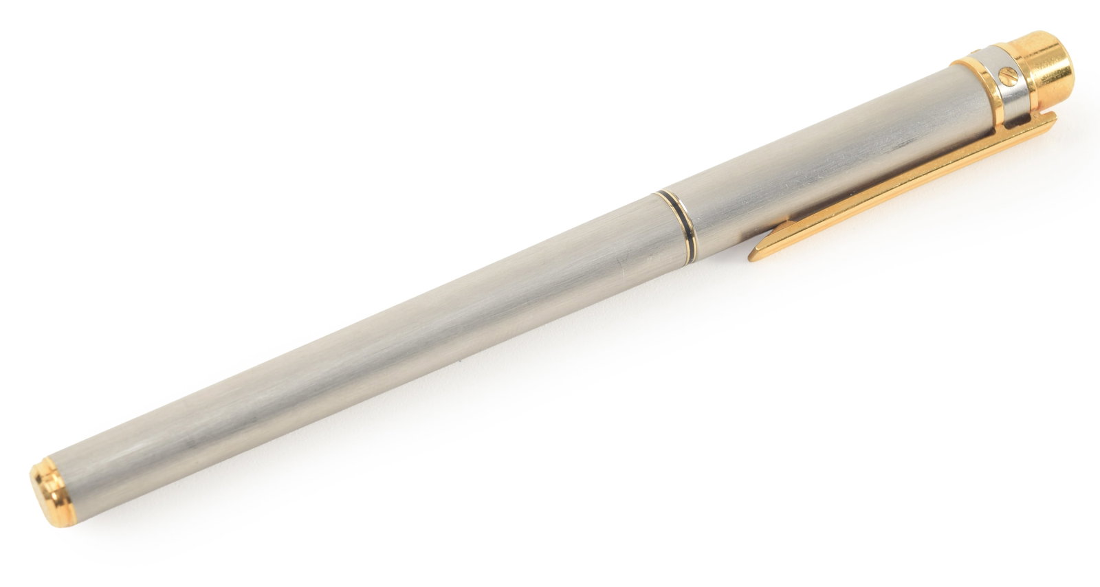 Cartier fountain pen with 18K gold nib. Graphite-grey case with gold tone metal accents. Topped with: Cartier fountain pen with 18K gold nib. Graphite-grey case with gold tone metal accents. Topped with a Cartier cap medallion bearing serial number 856962.