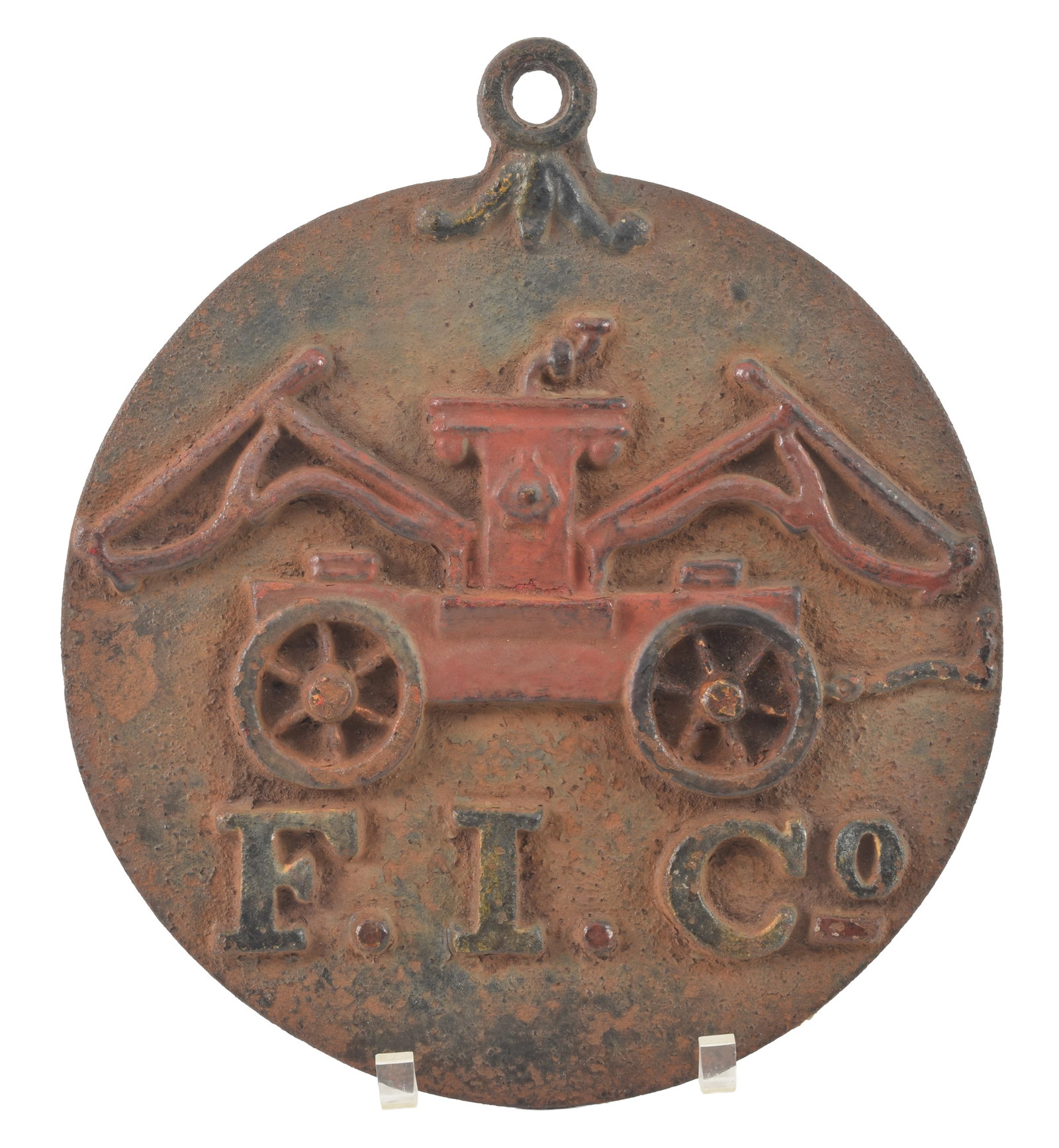Antique cast iron fire mark, F.I. Co. with fire pumper retaining some original paint. Diameter 11 (1 of 3)