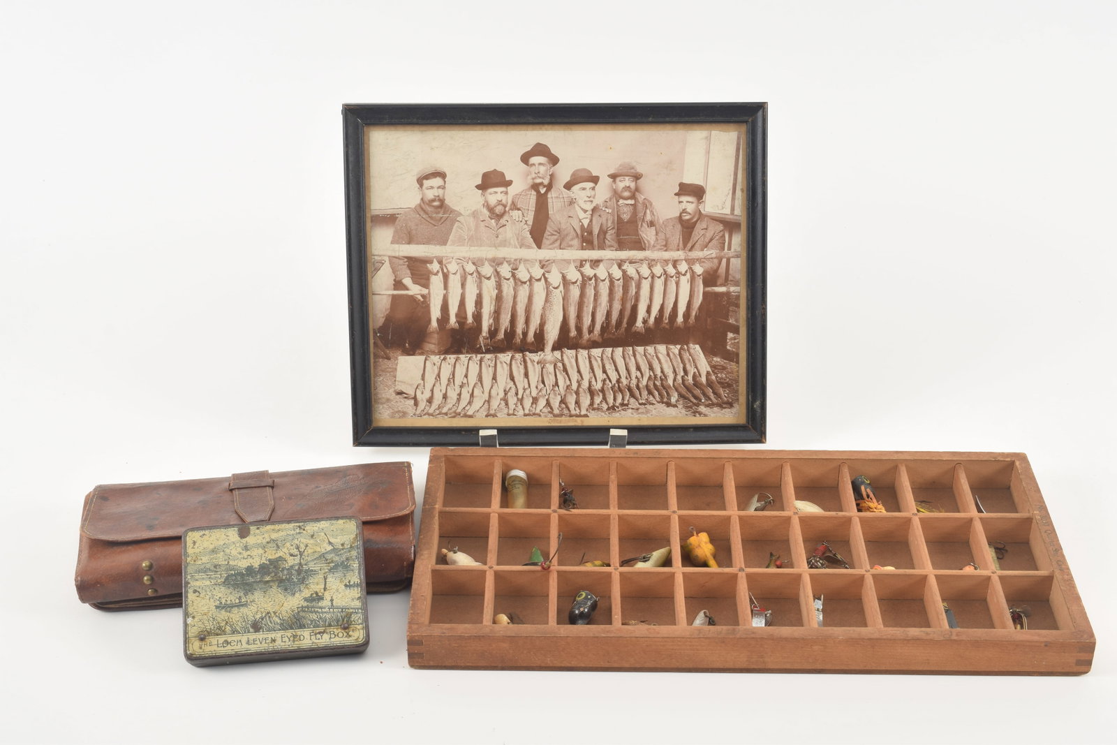 Collection of 4 fishing items, including a Commons Sense leather fly tackle book, a fly tin marked (1 of 10)