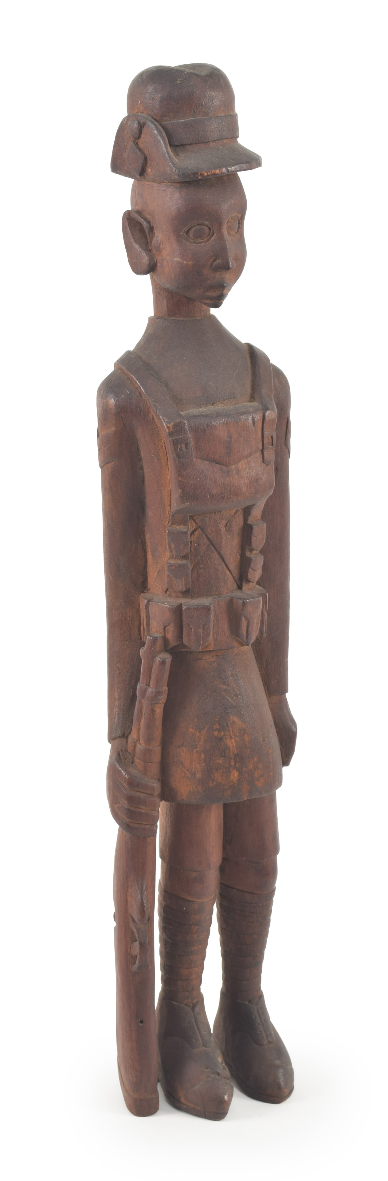 Early 20th century folk art carving of a soldier in uniform with rifle. 20.5in high. Provenance:: Early 20th century folk art carving of a soldier in uniform with rifle. 20.5in high. Provenance: From the Rex Stark collection of Gardner, Massachusetts.