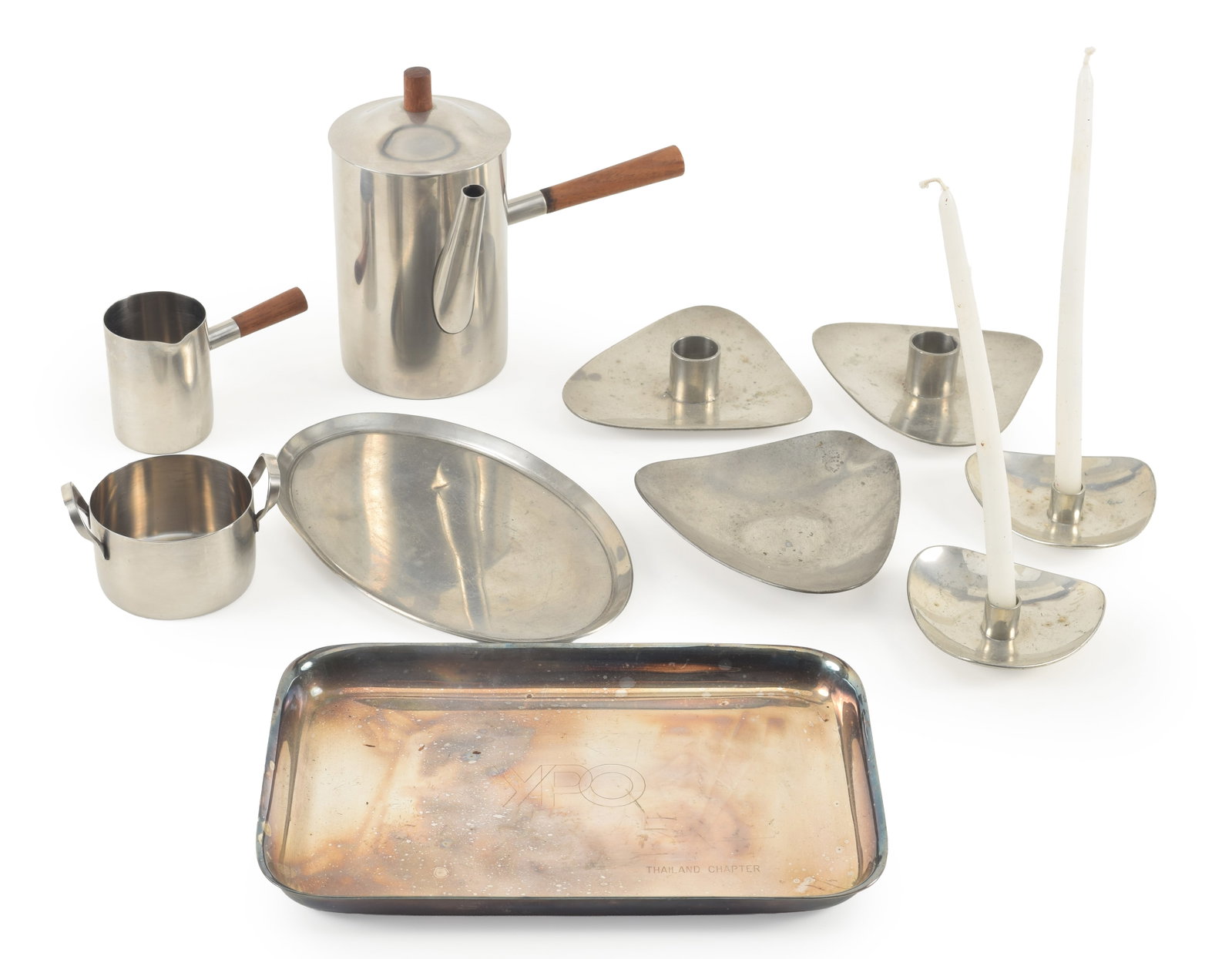 10 pieces of mid century modern stainless steel items, including coffee pot, candlesticks, and: 10 pieces of mid century modern stainless steel items, including coffee pot, candlesticks, and trays. Largest: 6.25in high.