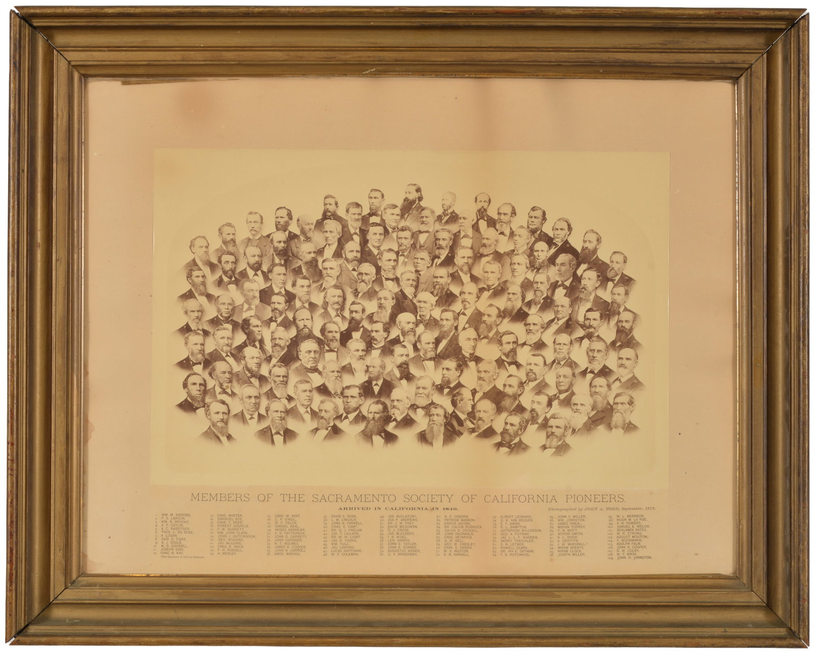 A historical composite photograph by John A. Todd, September 1878. Titled "Members of the Sacramento: A historical composite photograph by John A. Todd, September 1878. Titled "Members of the Sacramento Society of California Pioneers". 109 Arranged bust photos and corresponding name grid. Framed. Sigh