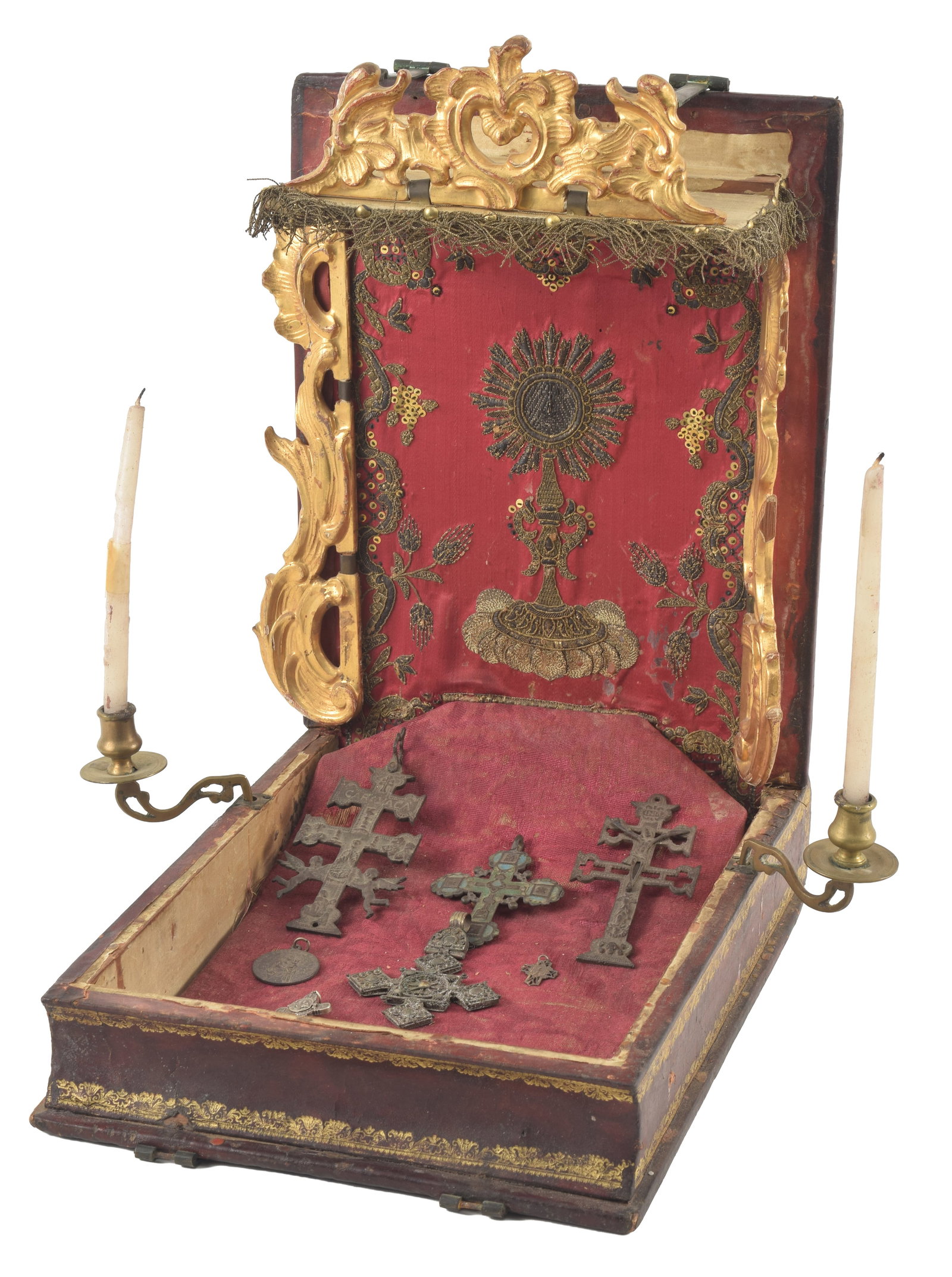 An 18th Century Baroque reliquary shrine with gilt gesso valances, ormolu candle arms and: An 18th Century Baroque reliquary shrine with gilt gesso valances, ormolu candle arms and embroidered panel. The tooled leather case with original brass hinges. Including related elements, such as sev