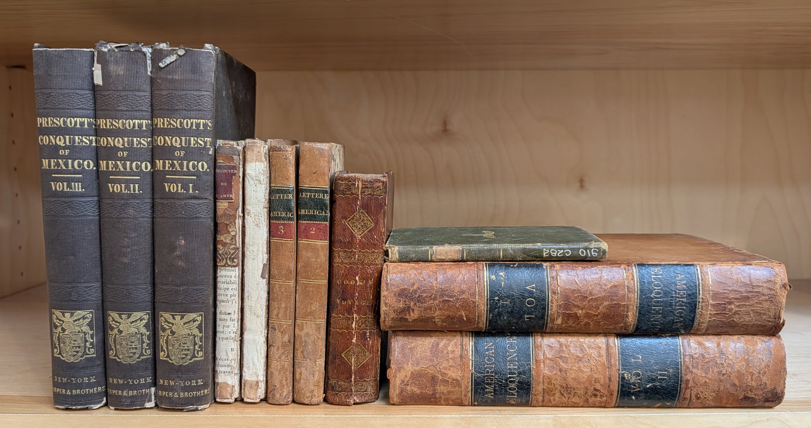 Lot of antique books. To include: 1824 Spanish Geography text with fold out world map; 1828 Voyages (1 of 6)