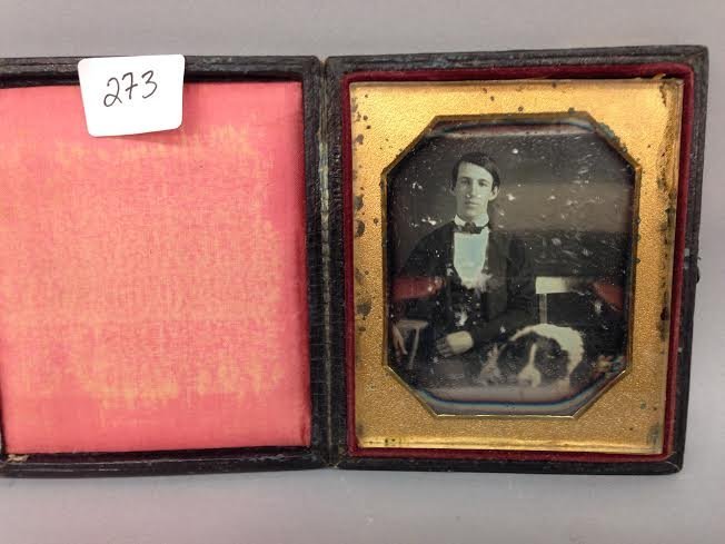 Antique Daguerreotype photograph of a man and his dog.: Antique Daguerreotype photograph of a man and his dog seated on a chair. Possibly a Saint Bernard. Case size- 3-3/4" x 3-1/8".