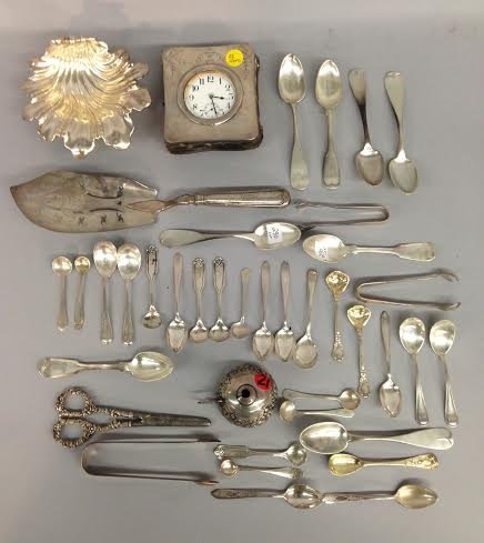 Assorted 19th & 20th Century Silver Items - clock, etc: An assortment of 19th and early 20th century flat silver items including demitasse spoons, tongs, silver clock, silver wine funnel and miscellaneous. Approx. 17 troy ozs.