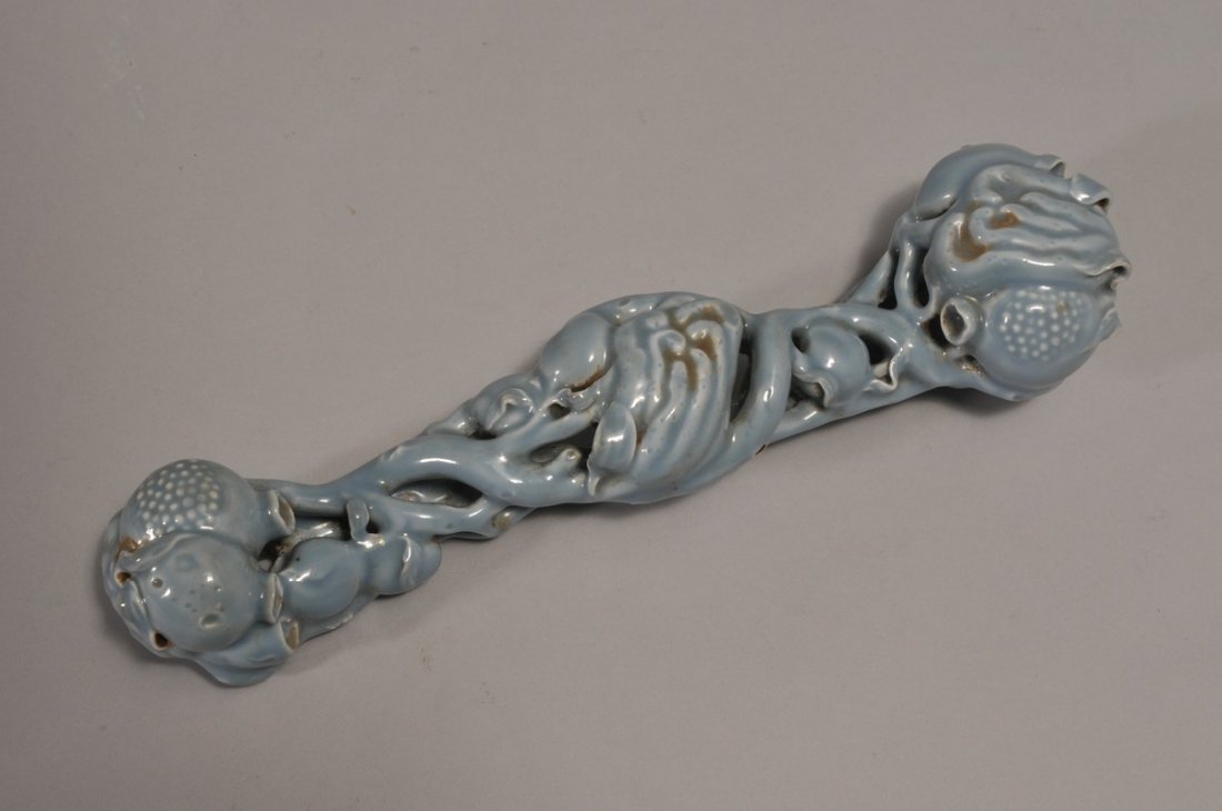 Porcelain Scepter. China. Early 20th century. Molded: Porcelain Scepter. China. Early 20th century. Molded in the form of the San Duo. Grey Blue glaze. 12" long.