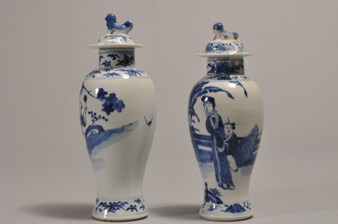 Pair of 19th century Chinese Blue and White covered: Pair of 19th century Chinese Blue and White covered garniture vases with figures in landscape. Double ring mark on base.