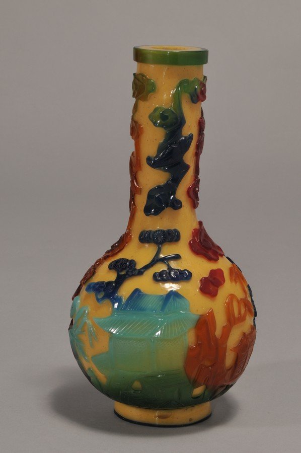 18th/19th century Chinese heavy Cameo carved Peking: 18th/19th century Chinese heavy Cameo carved Peking Glass Seven-Color Bottle vase with Landscape, Bats and Buddhist symbols. Hole drilled for lamp. Chip on base rim. Air pocket holes. 9-1/4" high. Wei
