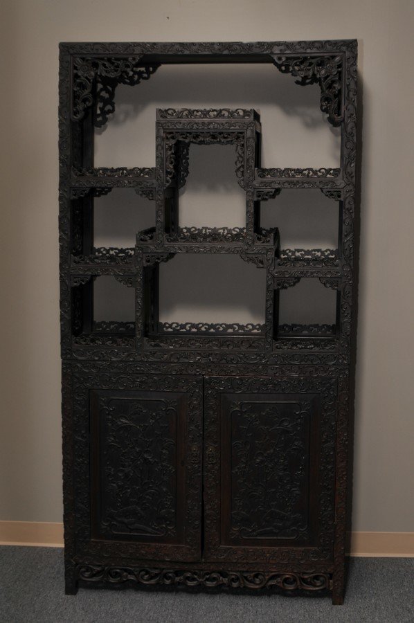 19th century Chinese carved Blackwood square two part: 19th century Chinese carved Blackwood square two part cabinet with all-over raised and pierced carved floral decoration. 39" w. x 78" h.