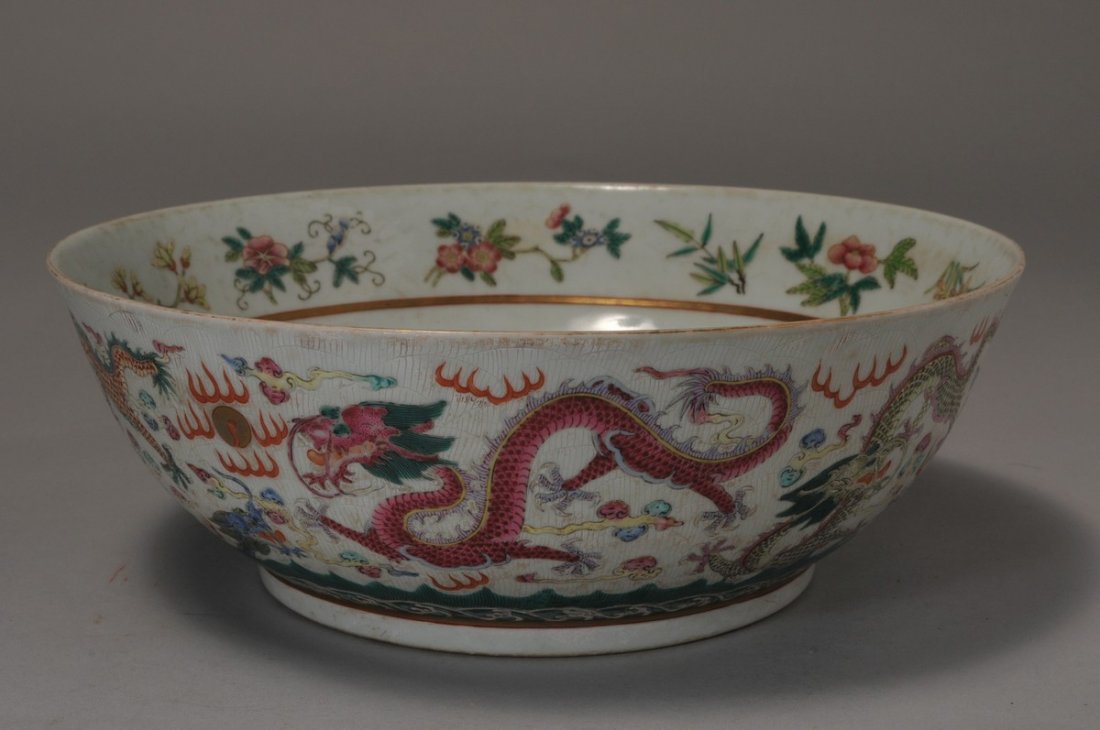 Porcelain Bowl. China. Kuang Hsu mark and possibly of: Porcelain Bowl. China. Kuang Hsu mark and possibly of the period. Famille Rose decoration of dragons and flowers. 10-3/4" d x 3-3/4" h.