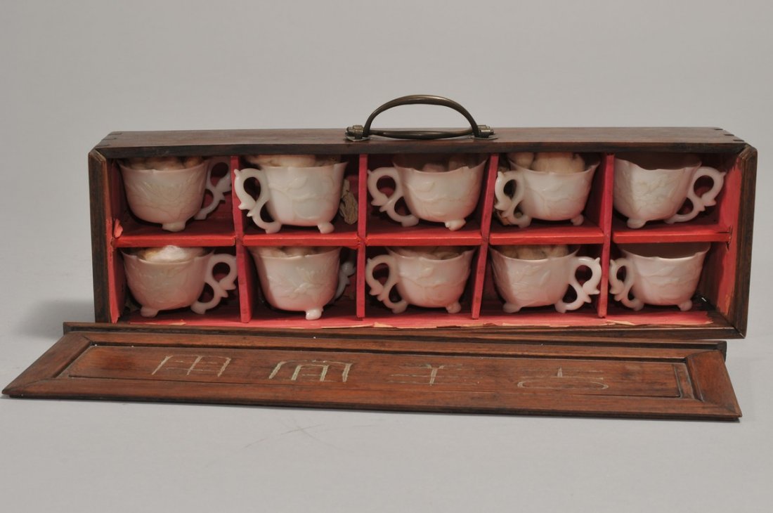 Set of ten wine cups. China. 19th century. White marble: Set of ten wine cups. China. 19th century. White marble carved with floral scrolls. Boxed in a Hung Mu case. Each cup approx. 1-1/2" high.