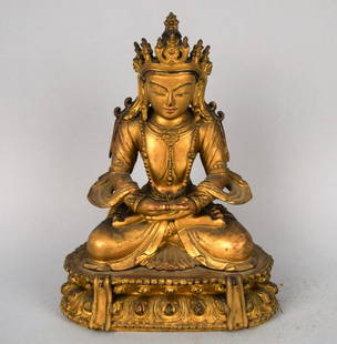 Carved wooden Buddha. China. Ch'ien Lung period: Carved wooden Buddha. China. Ch'ien Lung period (1735-1795). Seated figure wearing royal jewels. Surface gold lacquered with traces of blue and red. 7". (cracks and minor loss. Provenance: from a