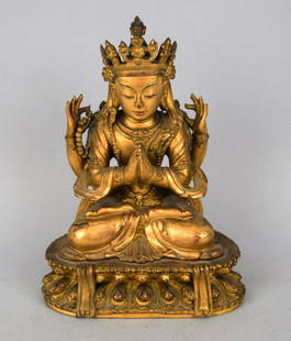 Carved wooden Buddha. China. Ch'ien Lung period: Carved wooden Buddha. China. Ch'ien Lung period (1735-1796). Seated figure of Shadakshari-Lokeshvara. Surface gold lacquered with traces of blue and red. 7-1/4". (cracks and minor loss). Provenance: