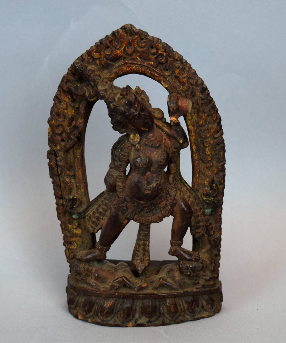 Carved wooden Buddhist image of Nepal of Tibet. 18th: Carved wooden Buddhist image of Nepal of Tibet. 18th century. Halo figure of Dakhini. Surface with traces of polychrome and gilt. 5-1/2" h. This item may have additional high-resolution photographs, a