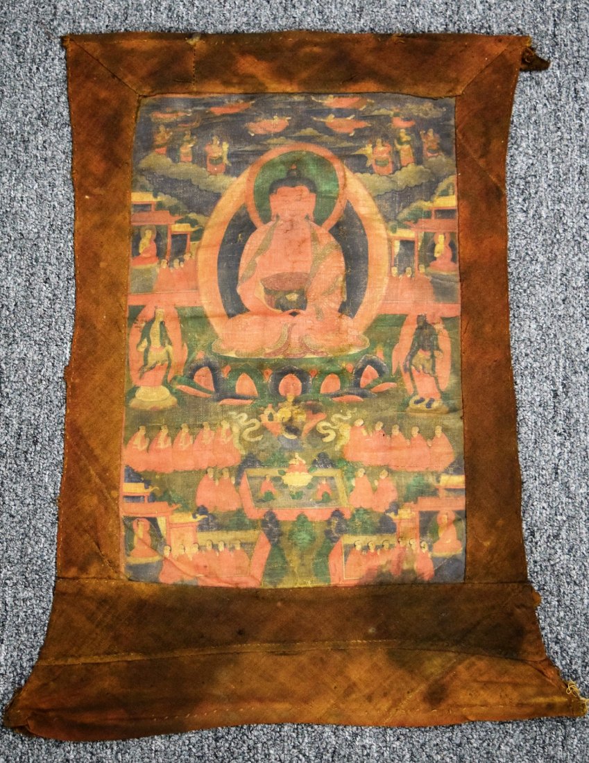 Buddhist Icon. Tibet. 19th century. Ink and colours on: Buddhist Icon. Tibet. 19th century. Ink and colours on cloth. Image of Amitabha with lineage figures. Worn. Stains. 16-1/4" x 10-1/2". Overall size: 23" x 16". This item may have additional high-resol
