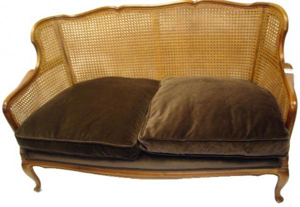 PAIR CARVED COUNTRY FRENCH SETTEES W/ CANE