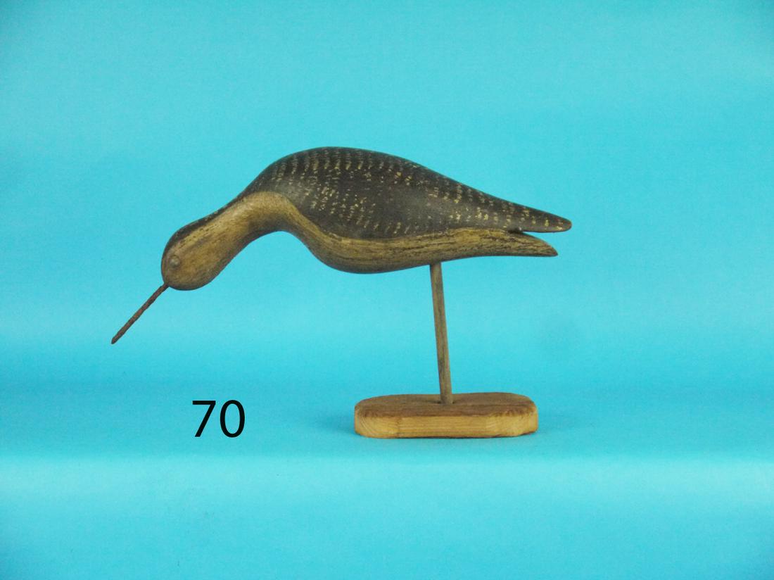FEEDING PLOVER: FEEDING PLOVER in antiqued original paint and condition. Split tail carving. Metal bill. One eye missing. Some areas of paint rub. 100-200