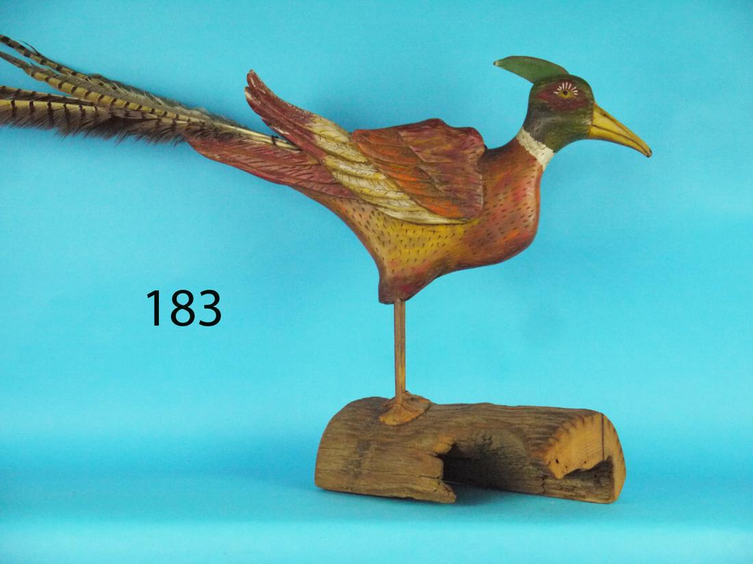 PHEASANT, SPAULDING: WHIMSICAL PHEASANT by Spaulding, Wildwood, NJ. Excellent orignal paint and condition. Applied wings and inserted pheasant tail feathers. Inserted metal comb on head. Mounted atop a driftwood base. Ove