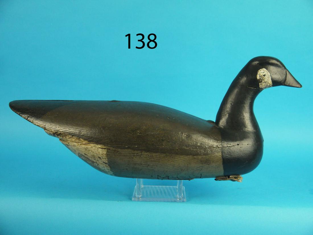 HUTCHINS GOOSE, H. GRANT: EARLY HUTCHINS GOOSE by Henry Grant, Barnegat, NJ, (1860-1924), circa 1890. Very old working paint and good structural condition. Both halves secured with two bolts. Split tail carving to back. Retain