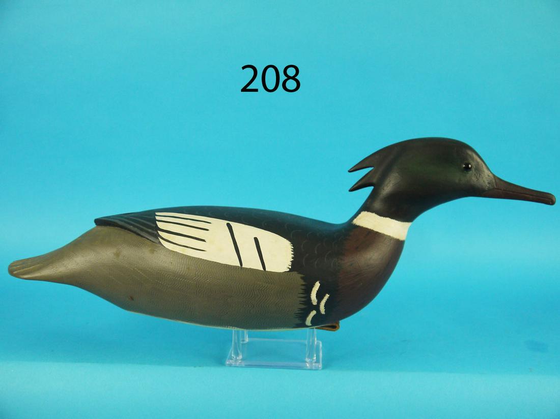 RED-BREAST MERGANSER DRAKE, C. FENNIMORE: RACEY RED-BREAST MERGANSER DRAKE by Clarence Fennimore, Wrightstown, NJ. Very good original paint and structural condition. Carved in a swimming position. Double-comb head carving. Raised carved wing 