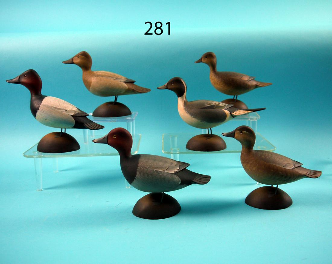 SET 25 CROWELL STYLE MINIATURES, G. STRUNK: UNIQUE SET OF 25 MINIATURE DECOYS by George Strunk, Glendora, NJ. The set, carved in the style of A.E. Crowell, consists of pairs of bluebills, redheads, mallards, pintails, canvasbacks and red breast