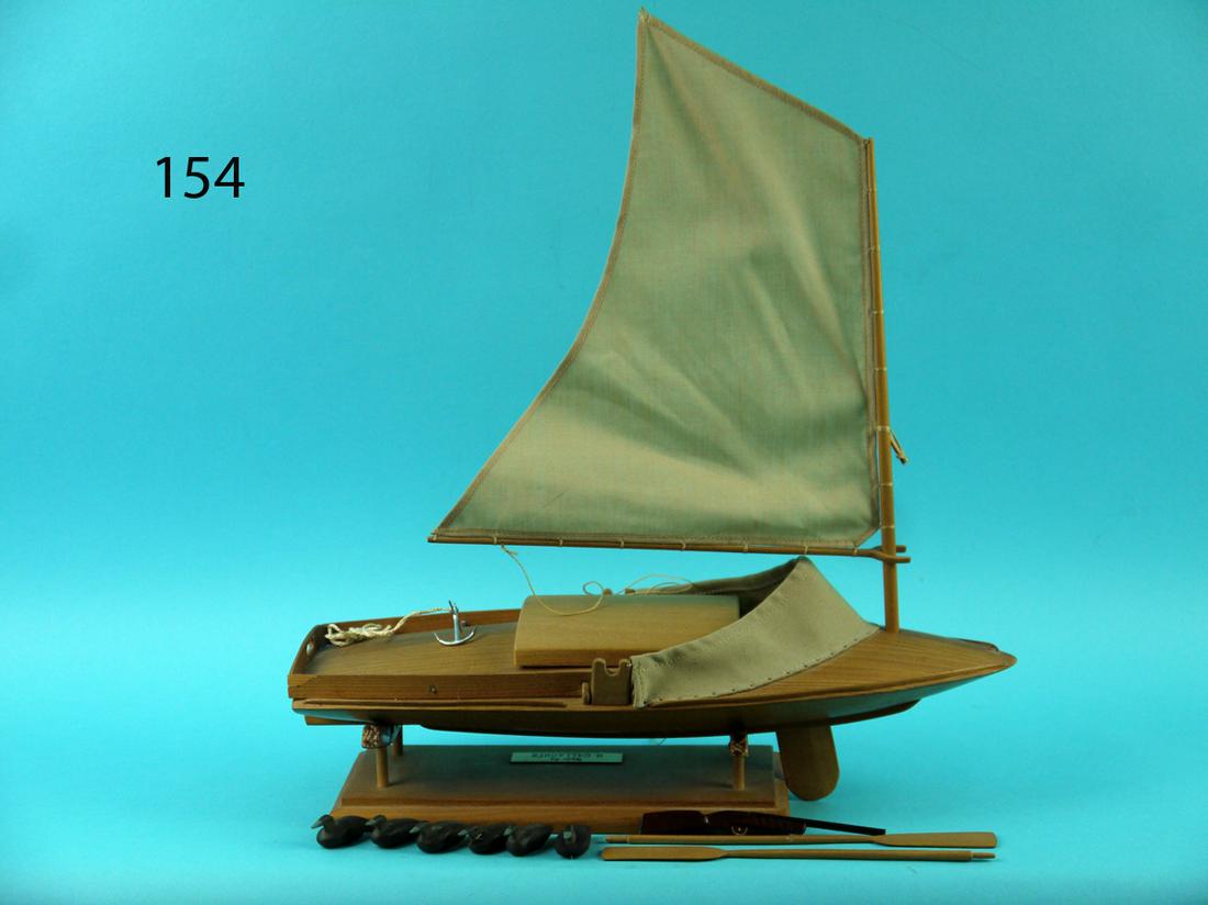 MINIATURE SNEAK BOX, H. GALLAGHER: VERY FINE MINIATURE SNEAK BOX by Howard Gallagher, Manahawkin, NJ. Expertly recreated with finely finished wood. Gaff-rigged sail. Six miniature decoys, hatch over, push pole, shot gun, centerboard, a