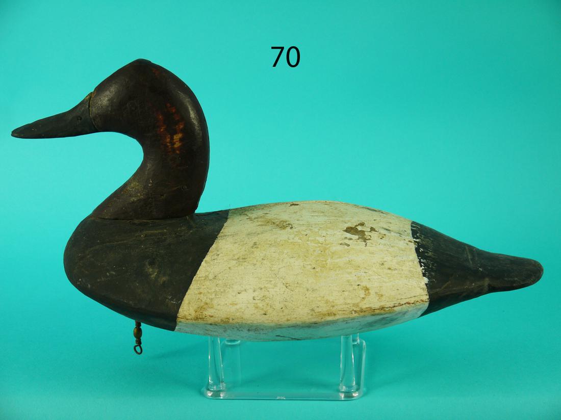 CANVASBACK DRAKE, UPPER BAY: EARLY CANVASBACK DRAKE from the Upper Bay, MD. Very old working paint and good structural condition. Vertical two-piece construction to head. Some shot scarring to head. Retains dog bone weight and ri