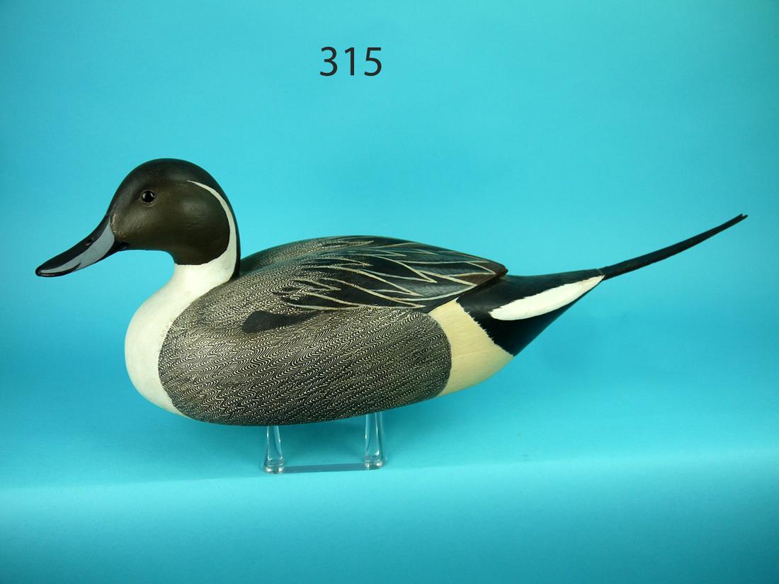 PINTAIL DRAKE, T. MCNULTY: FINE PINTAIL DRAKE by Terry McNulty, Delran, NJ. Excellent original paint and unused condition. Relief-carved wings with split wing tips and elongated sprig tail. Comb feather painting to body. Head t